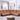 Tan leather sectional sofa with reclining features, set in a bright living room with large windows and contemporary decor.