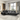Modern black leather sectional sofa with reclining feature, set in a bright living room with large windows and contemporary decor.